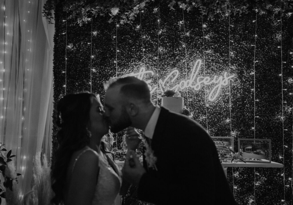 wedding reception dessert bar and neon sign